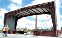 Metal building with heavy concrete walls