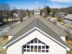 Rood Roofing installed approximately 12,000 square feet of Englert Inc.'s 24-gauge, 20-inchwide Series 1300 standing seam metal roof panels in Medium Bronze on St. Ann Church.