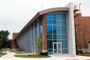 A modern, technological aesthetic was created for the J.D. and Mary West Science Laboratory at Southern Nazarene University with curves throughout the design.