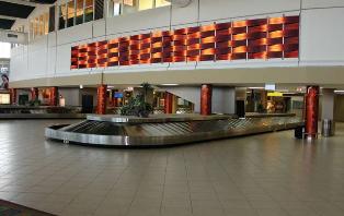 Claudia Ruiz-Vasquez of ArteSano Design Studio specified Móz Designs Inc.'s decorative metal surfacing in Classic Colors throughout terminals at Queen Beatrice International Airport.