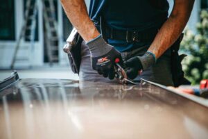 A trade professional uses a pair of snips for easy cutting