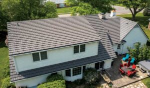 A suburban home featuring aluminum roofing designed to mimic wood shakes