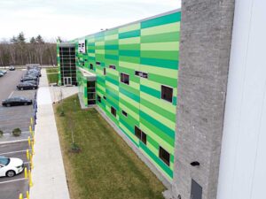 On the entrance facade, CES installed 76.2-mm (3-in.) thick IMPs in three custom green colors and a flat finish.