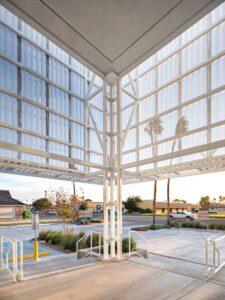 Sunlight hits the covered entrance to Mission Restaurant Supply