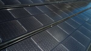 Close-up view of solar panels with a focus on the intricate cell patterns and grid lines.