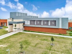 To create a modern exterior on Belton High School, O’Connell Robertson and Associates Inc. specified a combination of flat and corrugated metal wall panels.