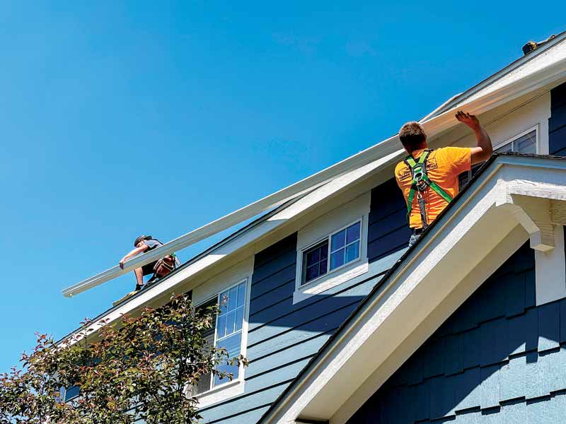 Courtesy New Tech Machinery Installing seamless gutters on-site using a portable gutter machine.