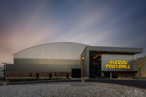 HOK-Sport, a division of HOK, specified gray insulated metal panels (IMPs) for Stephens Indoor Facility at University of Missouri, which match school branding.
