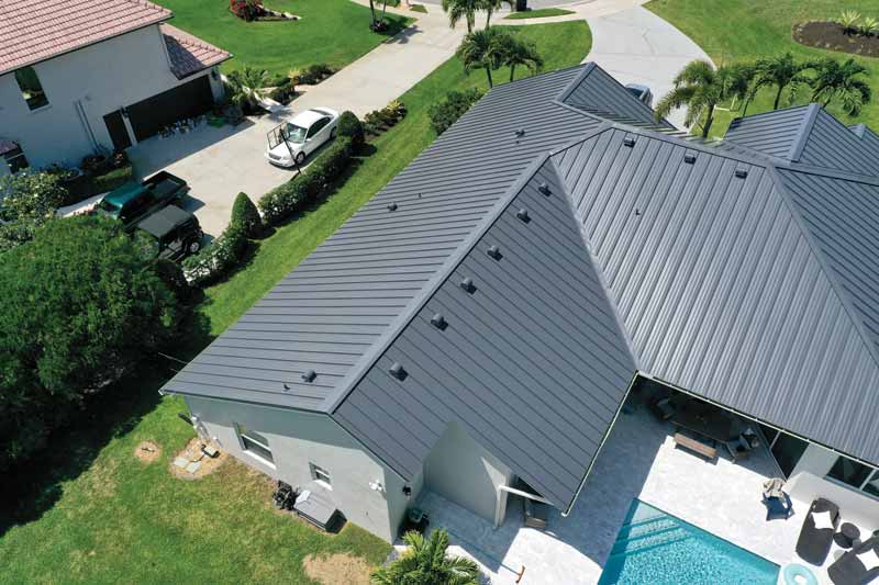 An overhead shot of a home with a metal roof. 