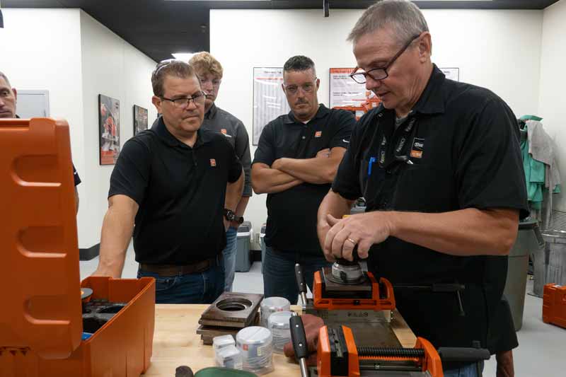 Courtesy FEIN Power Tools A team discusses keeping tools in top condition.