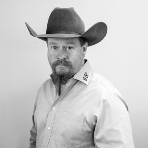 A black-and-white headshot of Shawn Haddock of S-5! 