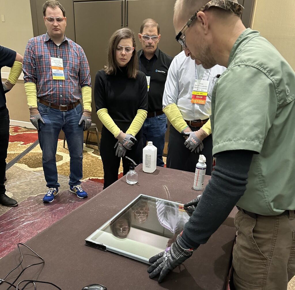 a group of people looking at a window framing mock-up