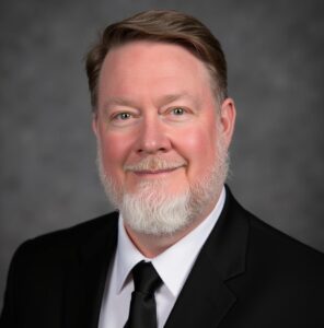 headshot of Michael Rhodes