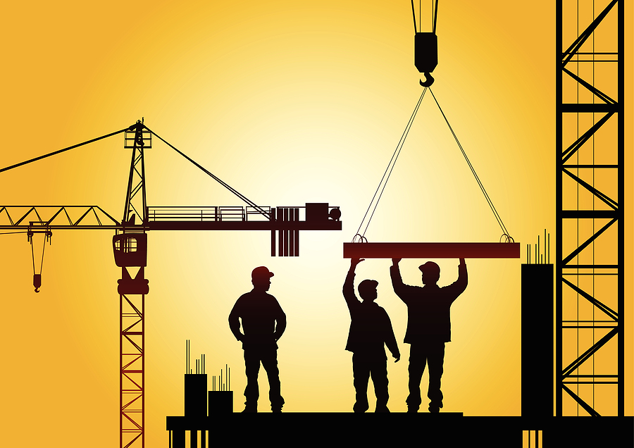 three construction workers in silhouette lighting
