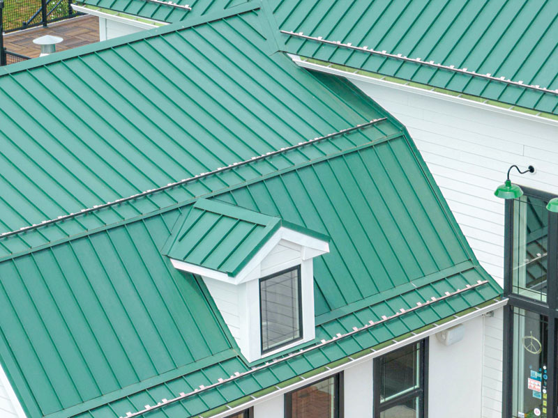 Photo courtesy Englert Houses with metal roofs and metal gutter systems.