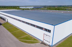 Photo (c) AdobeStock/Courtesy Gaco warehouse building from the height, a platform for transport. The type of sealant used in this construction is very important.