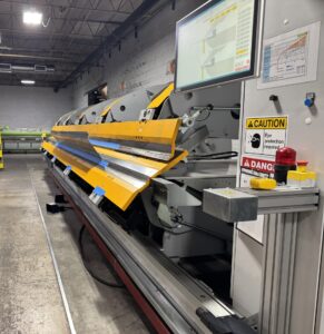 A folding machine in a manufacturing plant. 