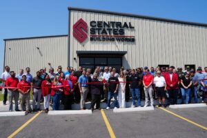 Employees gather for a ribbon-cutting at a Central States plant in Arkansas. 