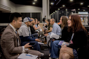 A number of attendees of METALCON speak during speed networking. 