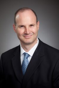 A headshot of Nick Longman, the new CEO of Construction Specialties