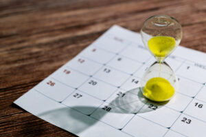 An hourglass on a calendar, meant to indicate the current construction backlog. 