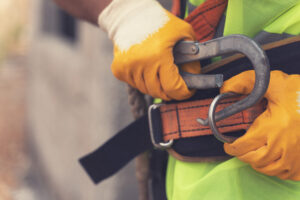 Photo (c) batuhan toker/Getty Images A worker fastening fall protection equipment, the most cited safety standard of the OSHA