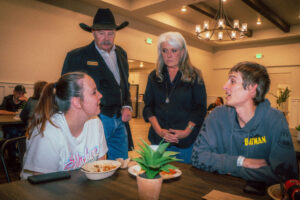 Team members from S-5 speak with patients at the Woody and Millie Ingram Guest House in Colorado Springs, Colo. 