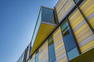 Photo courtesy ATAS International, Inc. Architectural metal plates on a building.