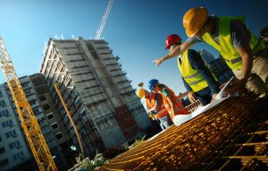Photo (c) gilaxia/Getty Images A construction team on site, showing the number of construction job openings in the market.