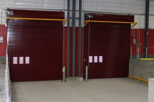 A set of rolling steel doors in a commercial building. 