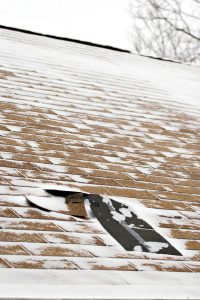 A roof damaged in a winter roof, a prime opportunity for contractor fraud. 